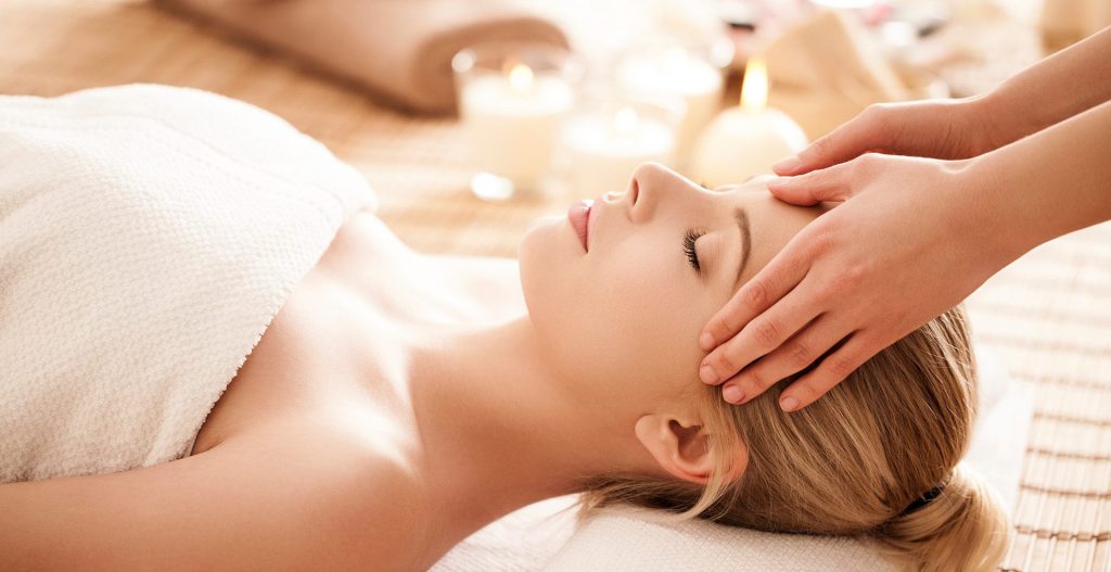 Young Woman Receiving Hot Stone Therapy